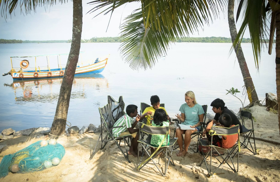 Emi Koch Working with Children on the Beach