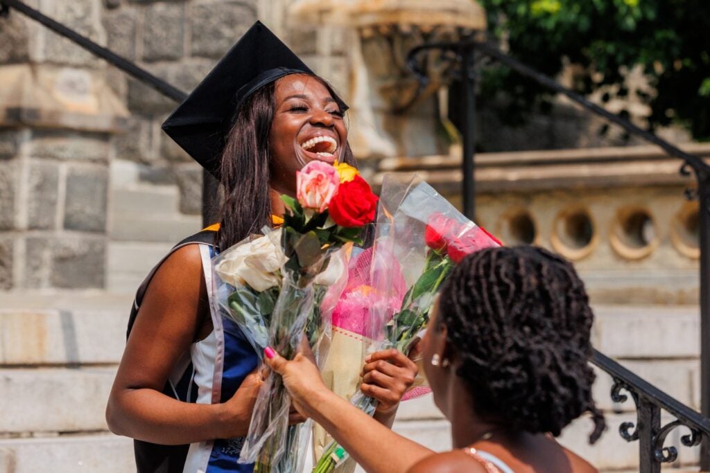 Back, education and black woman with graduation, celebration and